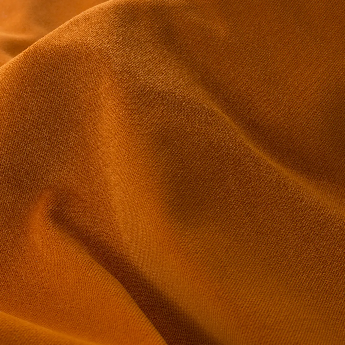 Detaliu material pentru draperie de catifea mată portocalie